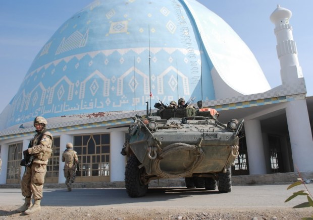 Canadian soldiers keep a close watch on their surroundings as representatives of the Canadian International Development Agency tour the Kandahar University campus in Kandahar City in 2008. Efforts to better protect the university’s 1,500 students — including about 75 women — prompted CIDA to fund the construction of a three-kilometre-long wall around the property. 