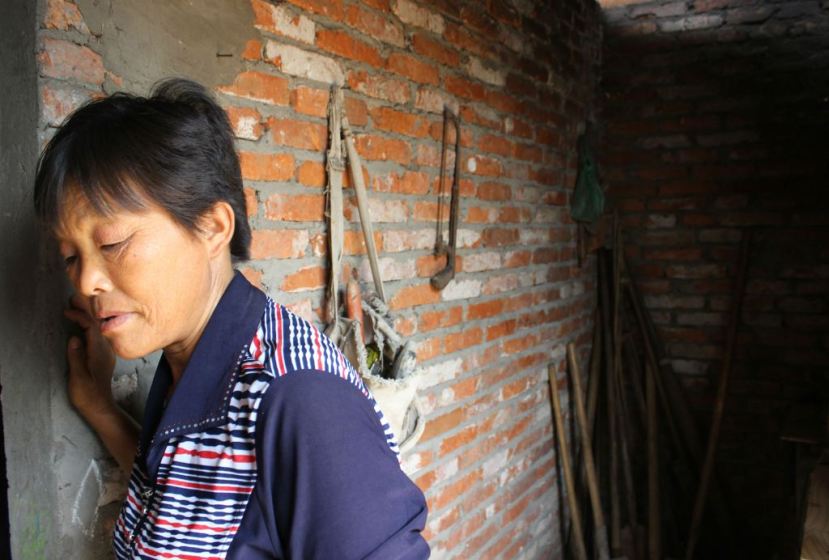 Zhang Chunlian has been waiting for news of when and where her family will be relocated for almost 20 years. Quartz / Lily Kuo.