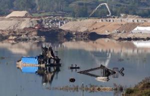 A partially-submerged factory is pictured near Jianying village in China's central Henan province on November 3, 2014.