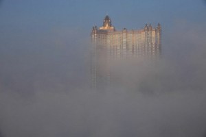 View of a high-rise building in heavy smog in Jilin province, Feb. 12, 2014. ImagineChina.