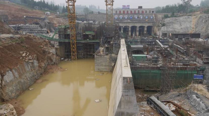 Construction crews put the finishing touches on the middle route of China’s South-North Water Diversion project in Henan province. The project’s three routes (two of which are completed) total nearly 2700 miles of man-made waterways that divert water from China’s water-rich south to its parched northern region. Rob Schmitz/Marketplace.